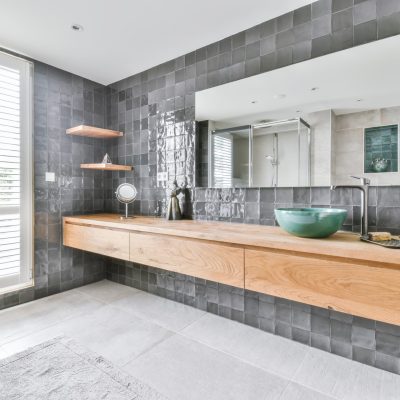 Stylish bathroom with large marble tiles on the walls and floor